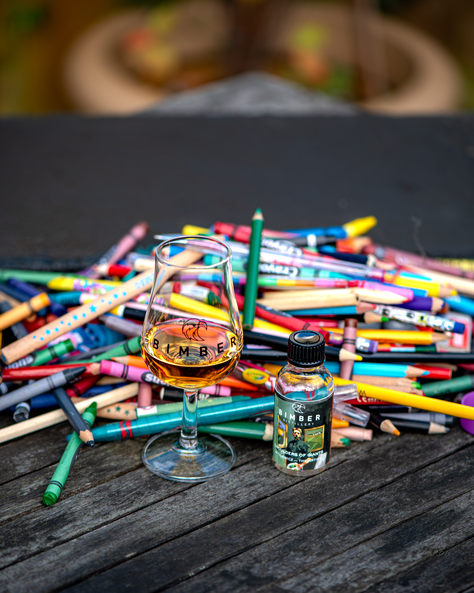 Picture from above of Shoulders of Giants - Bimber Witkiewicz - The Artist Whisky in front of pencils and crayons